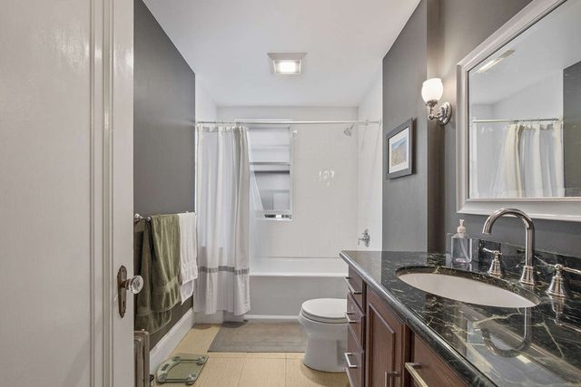 a living room with fireplace furniture and a flat screen tv