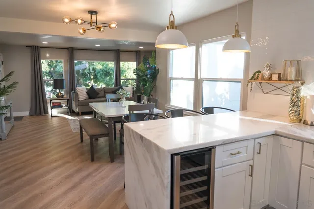 a view of a chair and table in backyard of the house