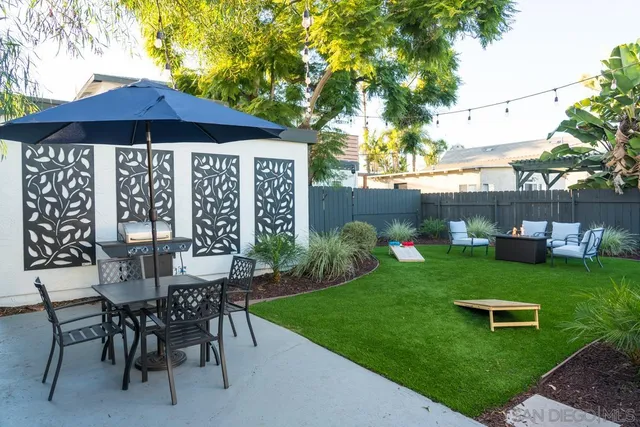 a view of a hallway with wooden floor and windows