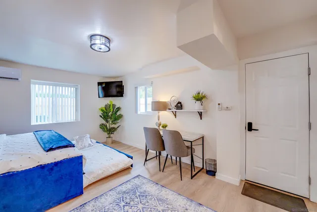 a bathroom with a sink mirror and vanity