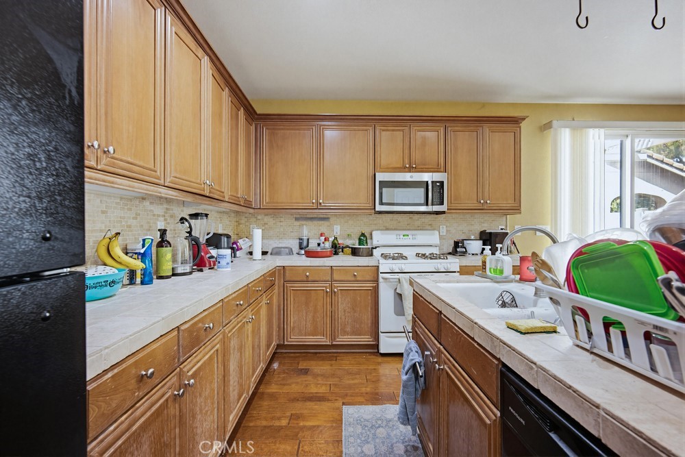 1747 Palermo Drive Riverside, CA 92507 - Photo 11 of 30 a kitchen with a sink cabinets and window