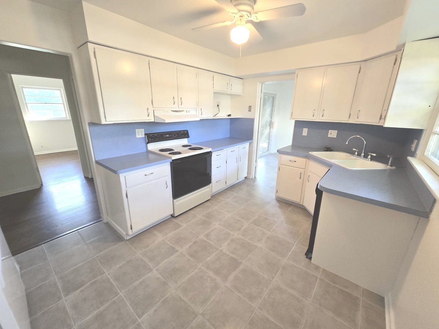 901 East Krage Drive Addison, IL 60101 - Photo 14 of 25 a kitchen with a sink and cabinets