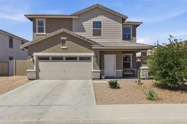 a front view of a house with a garage