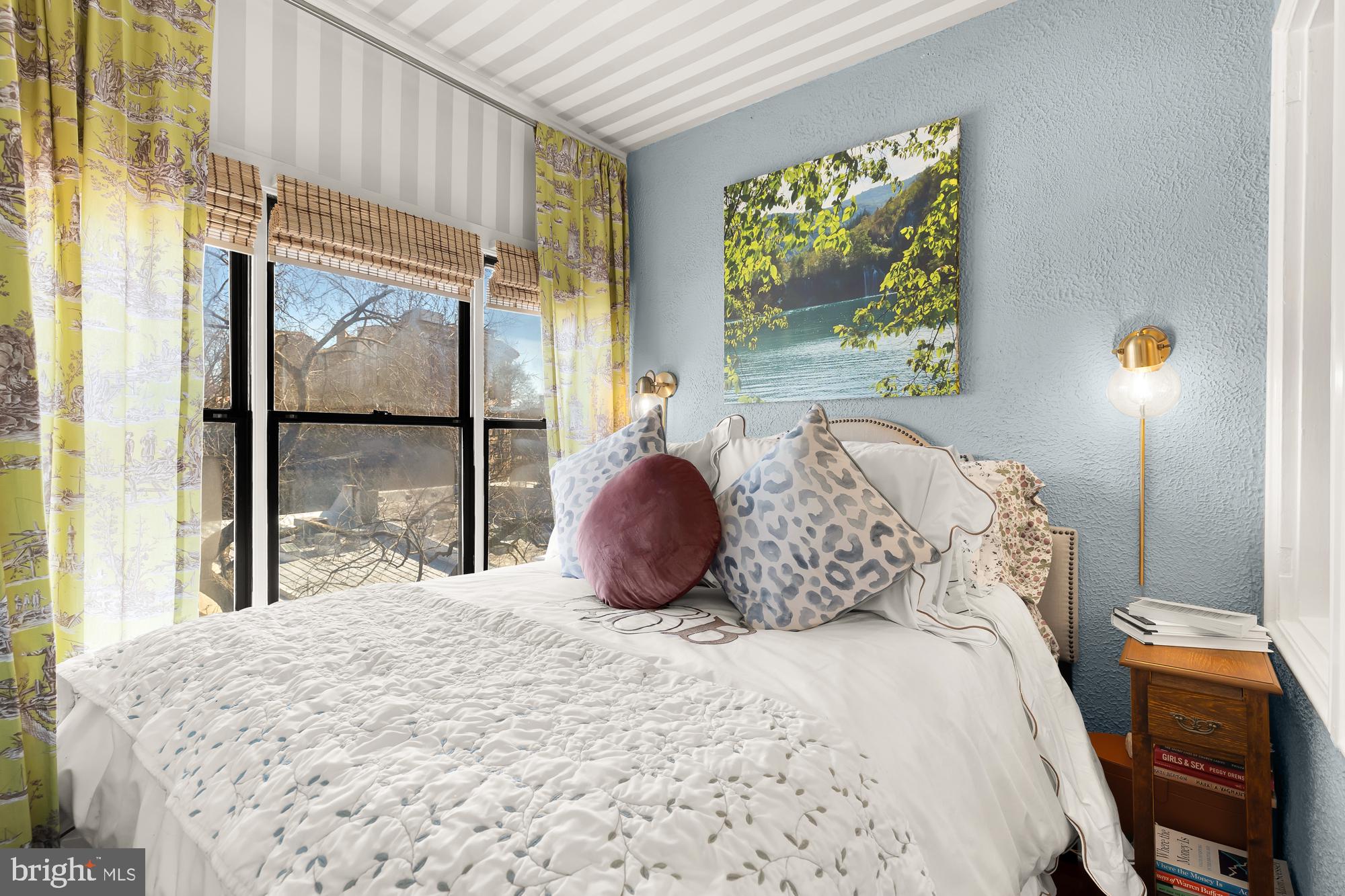 2040 Belmont Road Northwest, Unit 628 Washington, DC 20009 - Photo 12 of 19 a bedroom with a bed and window