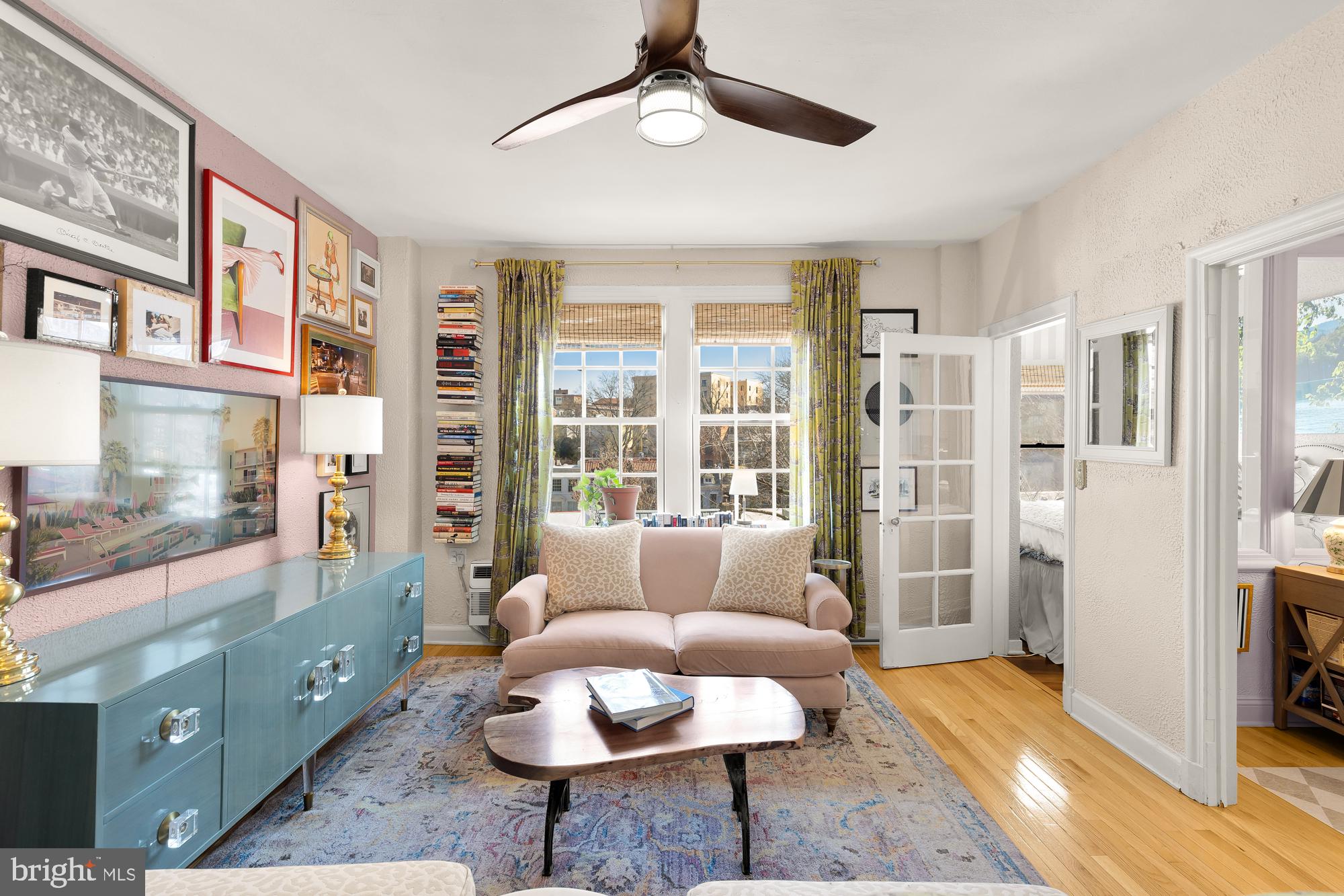 2040 Belmont Road Northwest, Unit 628 Washington, DC 20009 - Photo 3 of 19 a living room with furniture and a floor to ceiling window
