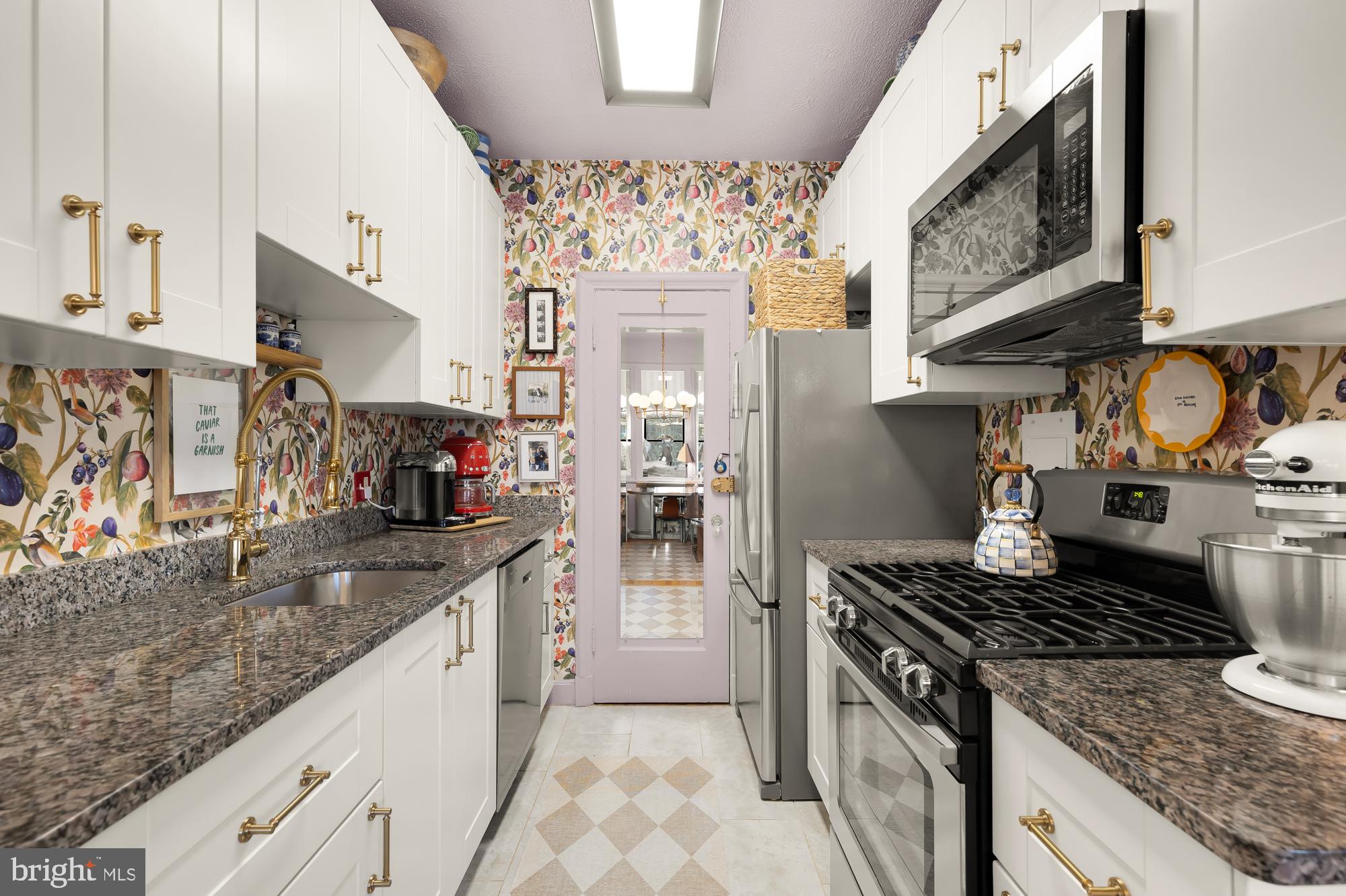 2040 Belmont Road Northwest, Unit 628 Washington, DC 20009 - Photo 8 of 19 a kitchen with stainless steel appliances granite countertop a stove and a sink