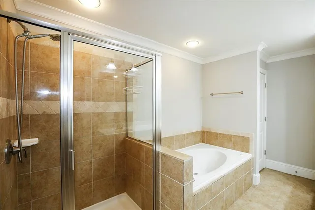 a bathroom with a tub and shower