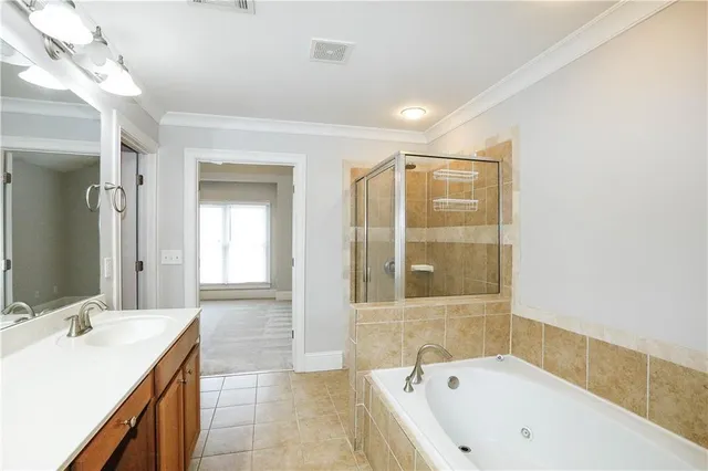 a bathroom with a bathtub and a sink