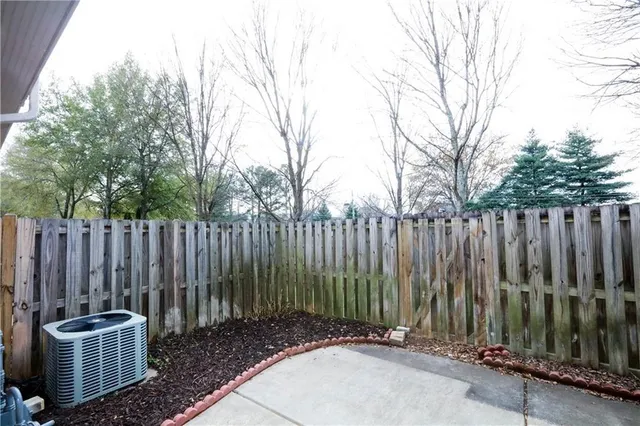 a view of outdoor space with wooden fence