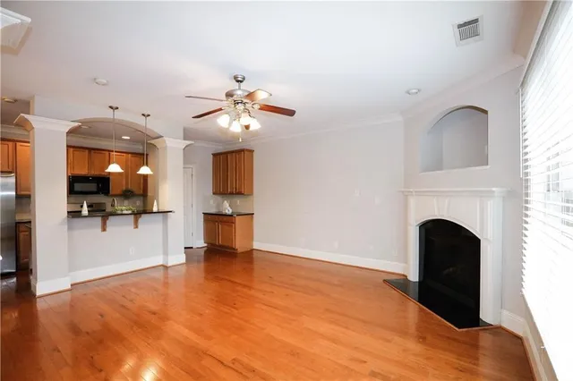 a view of an empty room with a fireplace