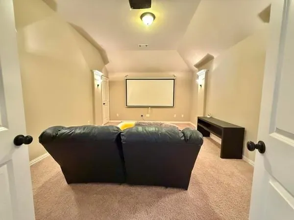 a bedroom with a bed and a cabinets