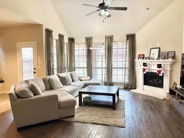 a living room with furniture and a fireplace