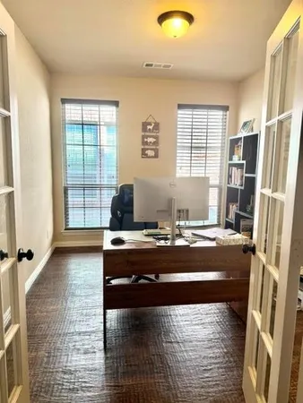 a living room with a bed furniture and a large window