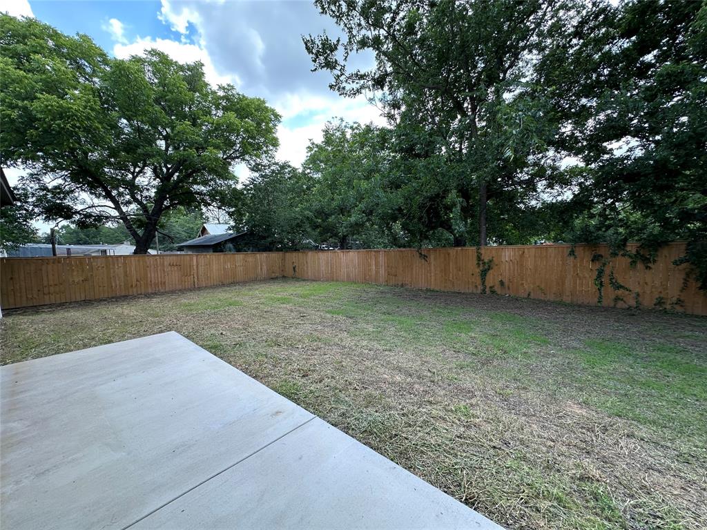 317 North Clark Street Comanche, TX 76442 - Photo 33 of 35 a view of backyard and tree