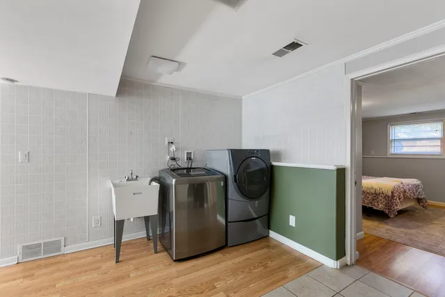 a utility room with closet dryer and washer