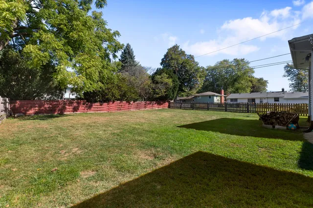 a view of a field with sitting area