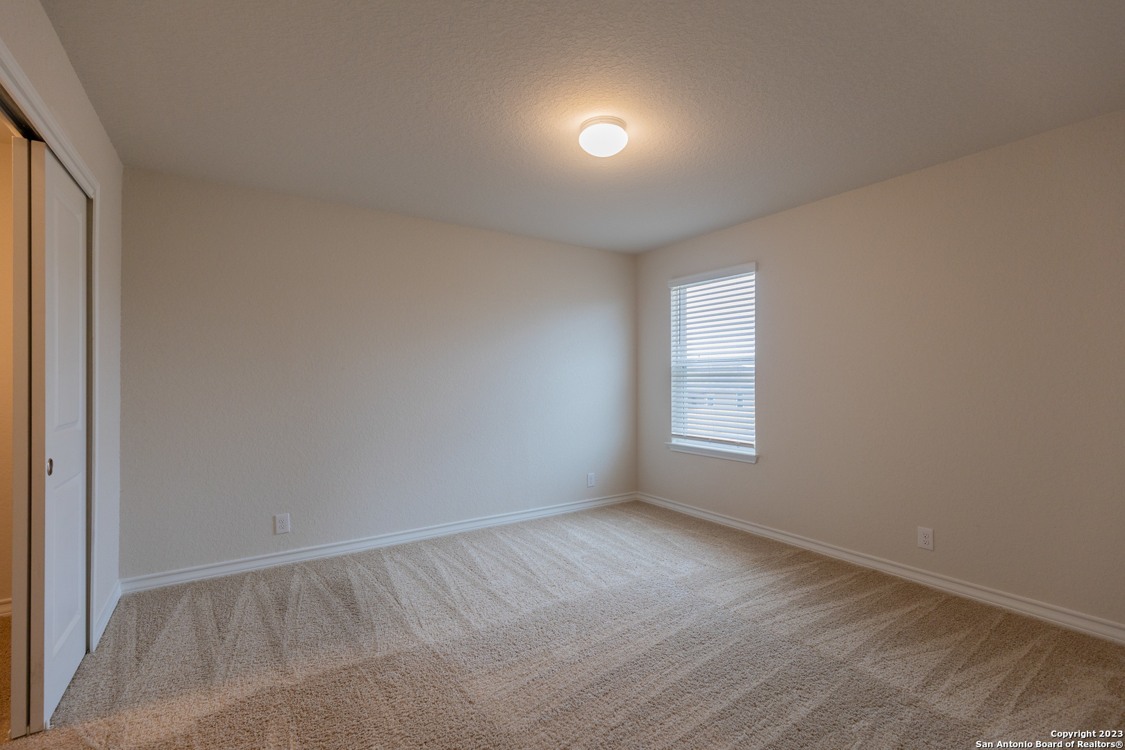 9819 Bratten Rise San Antonio, TX 78254 - Photo 21 of 37 a view of an empty room with a window