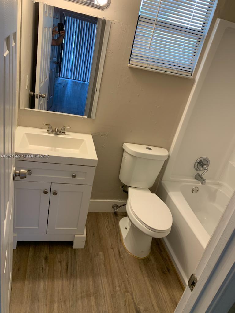 3263 Kirk Road, Unit 2 Lake Worth, FL 33461 - Photo 11 of 14 a bathroom with a sink and a toilet