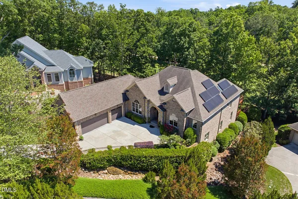 an aerial view of a house with a garden