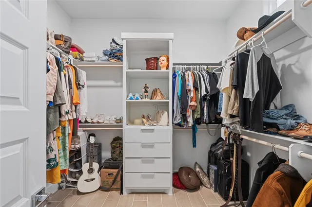 a white toilet sitting next to a white sink