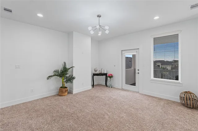 a view of a hallway with toilet and a hallway