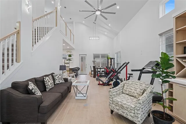 a living room with furniture and a potted plant