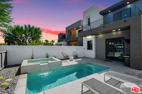 a backyard of a house with seating space