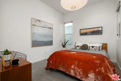 a bathroom with a sink a toilet and shower curtain