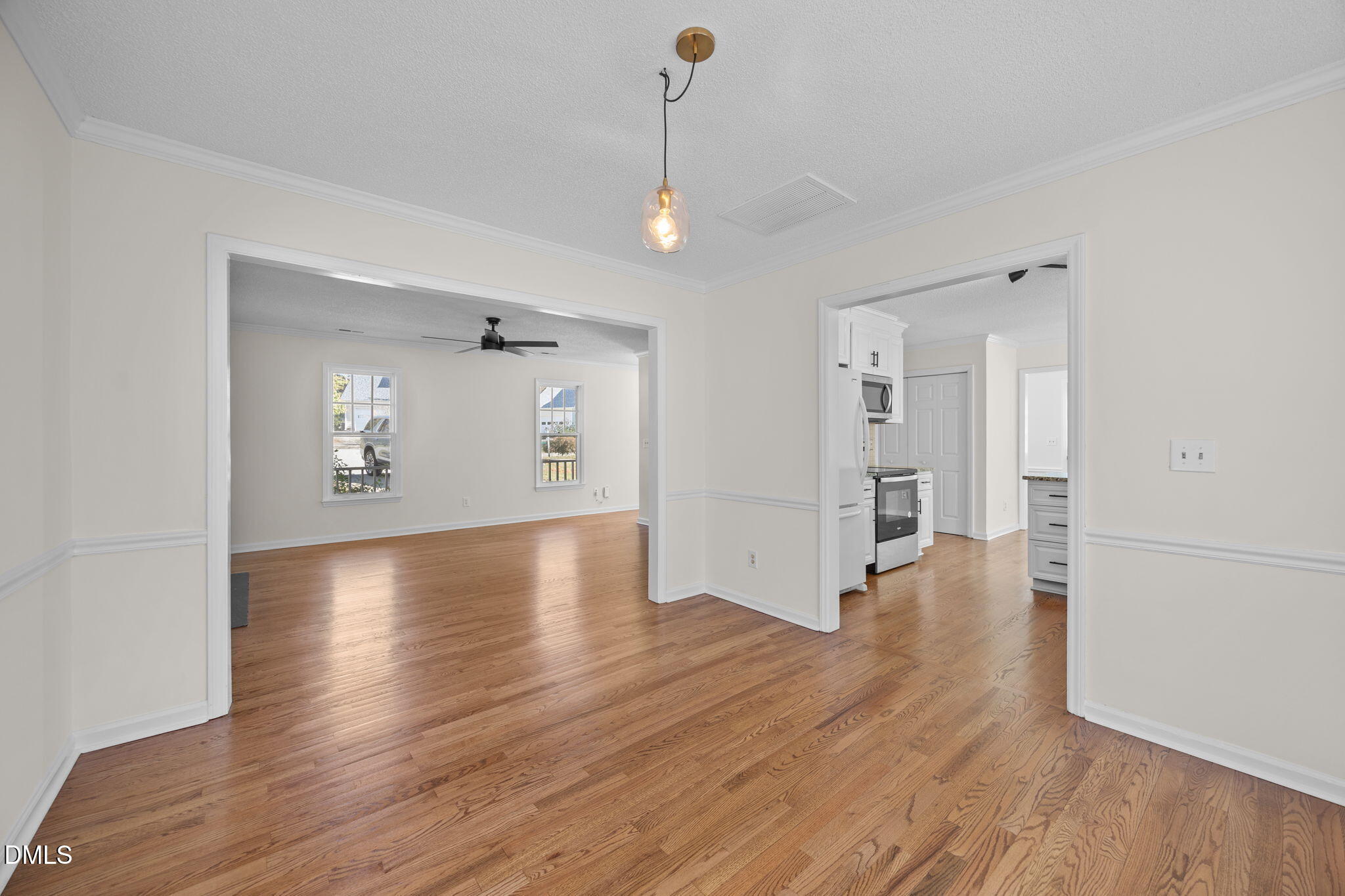 102 Korbel Place Cary, NC 27513 - Photo 11 of 43 wooden floor in an empty room with a window