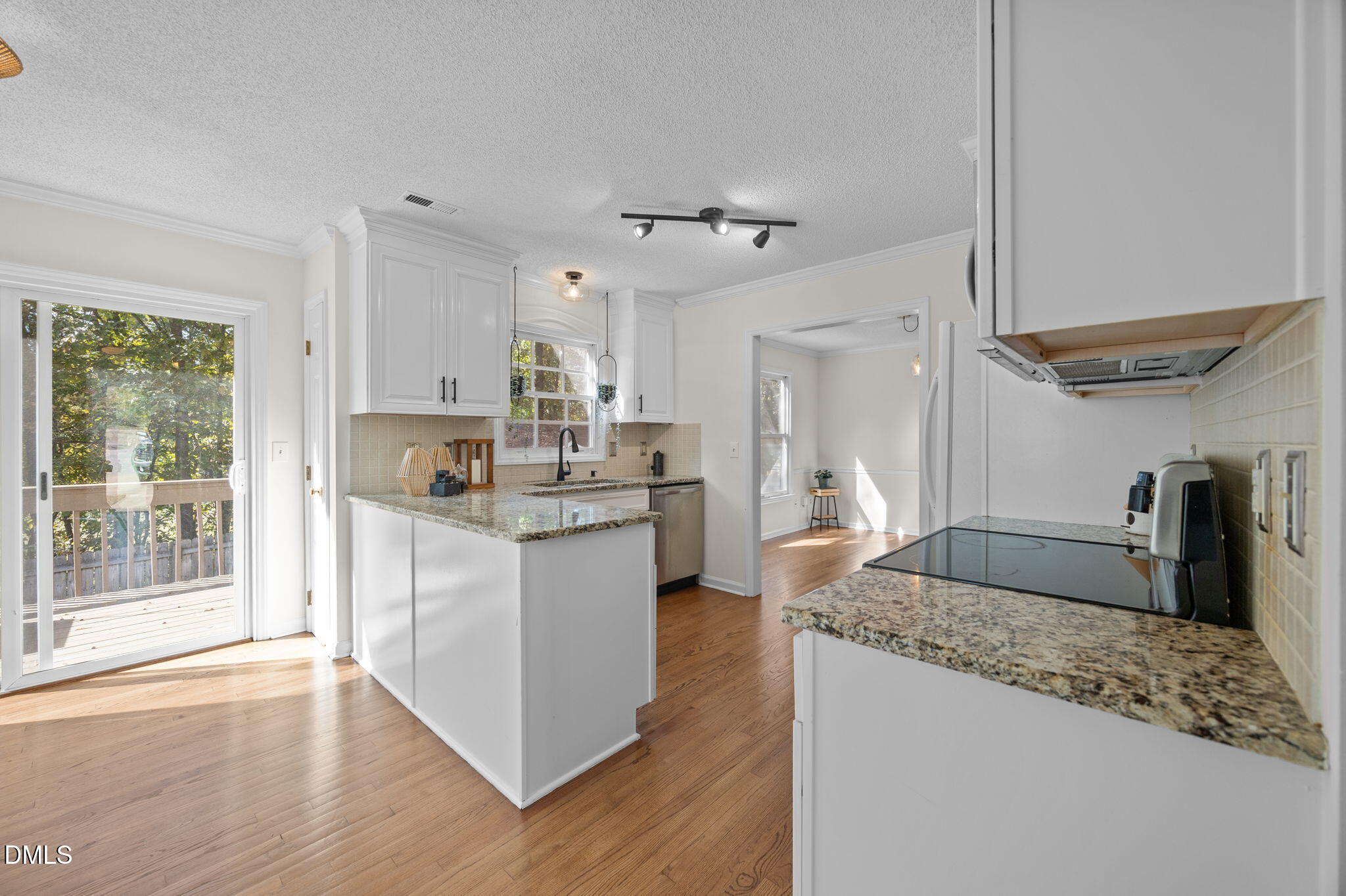 102 Korbel Place Cary, NC 27513 - Photo 15 of 43 a kitchen with stainless steel appliances granite countertop a sink stove and refrigerator