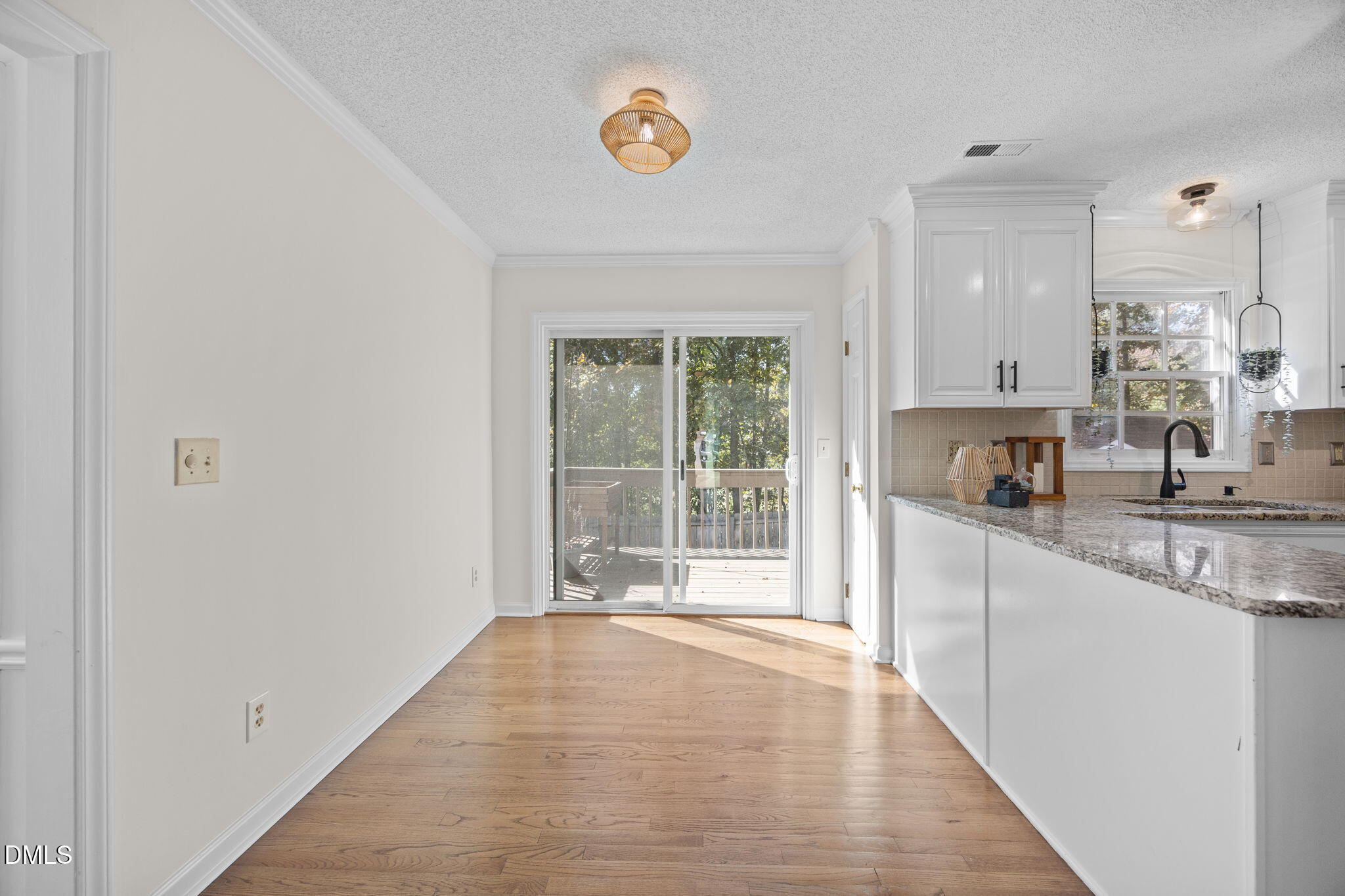 102 Korbel Place Cary, NC 27513 - Photo 17 of 43 a view of a kitchen with a sink and dishwasher with wooden floor