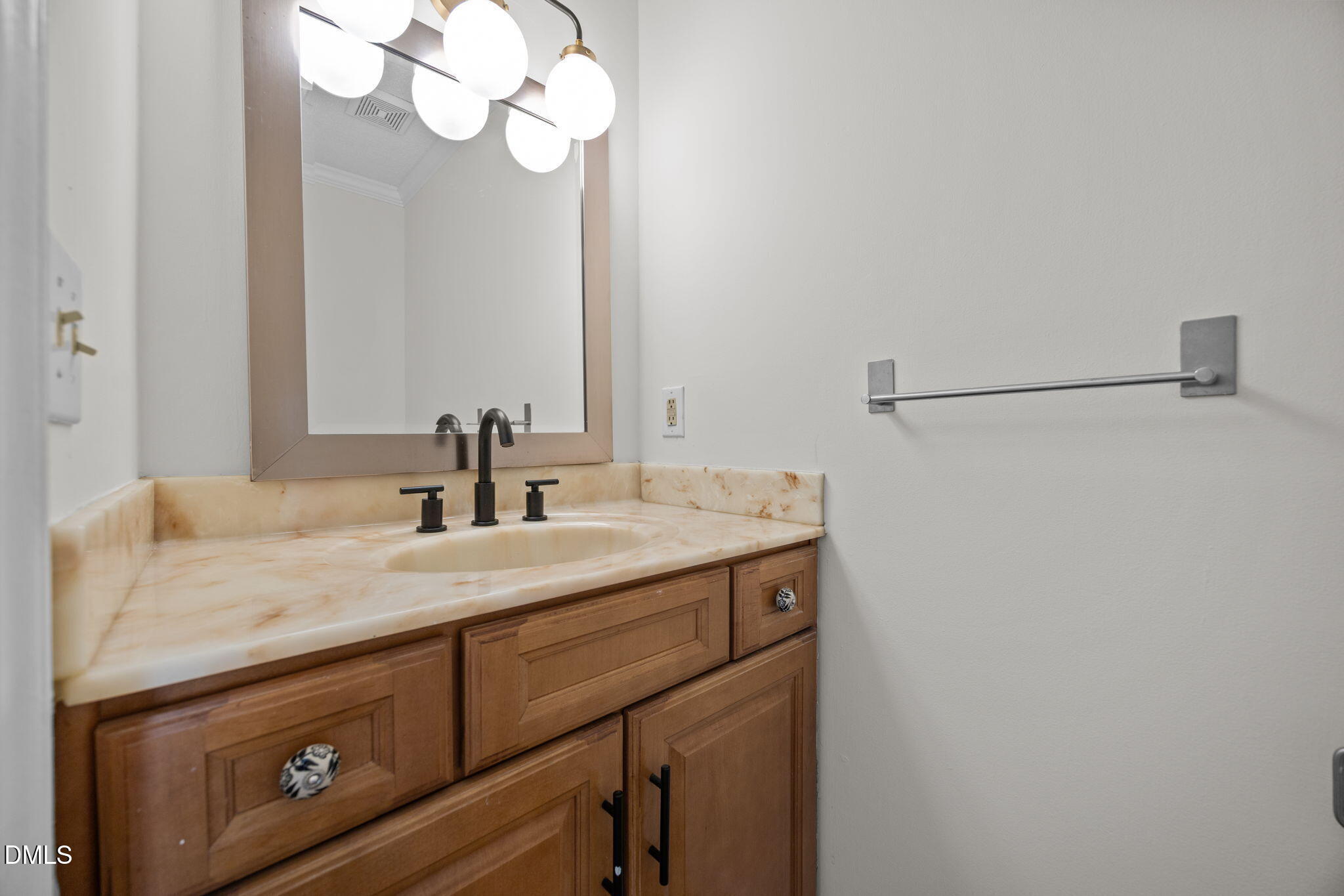 102 Korbel Place Cary, NC 27513 - Photo 19 of 43 a bathroom with a sink and a mirror