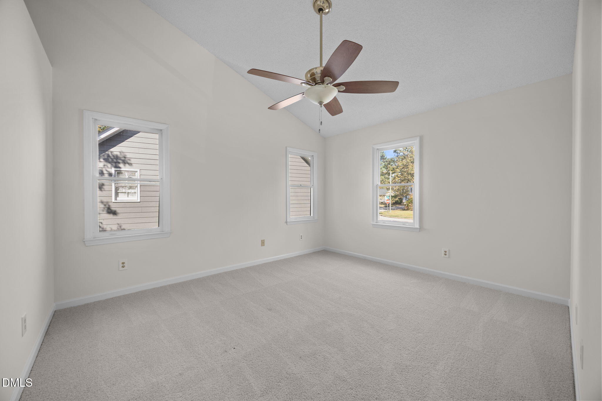 102 Korbel Place Cary, NC 27513 - Photo 20 of 43 an empty room with windows and fan