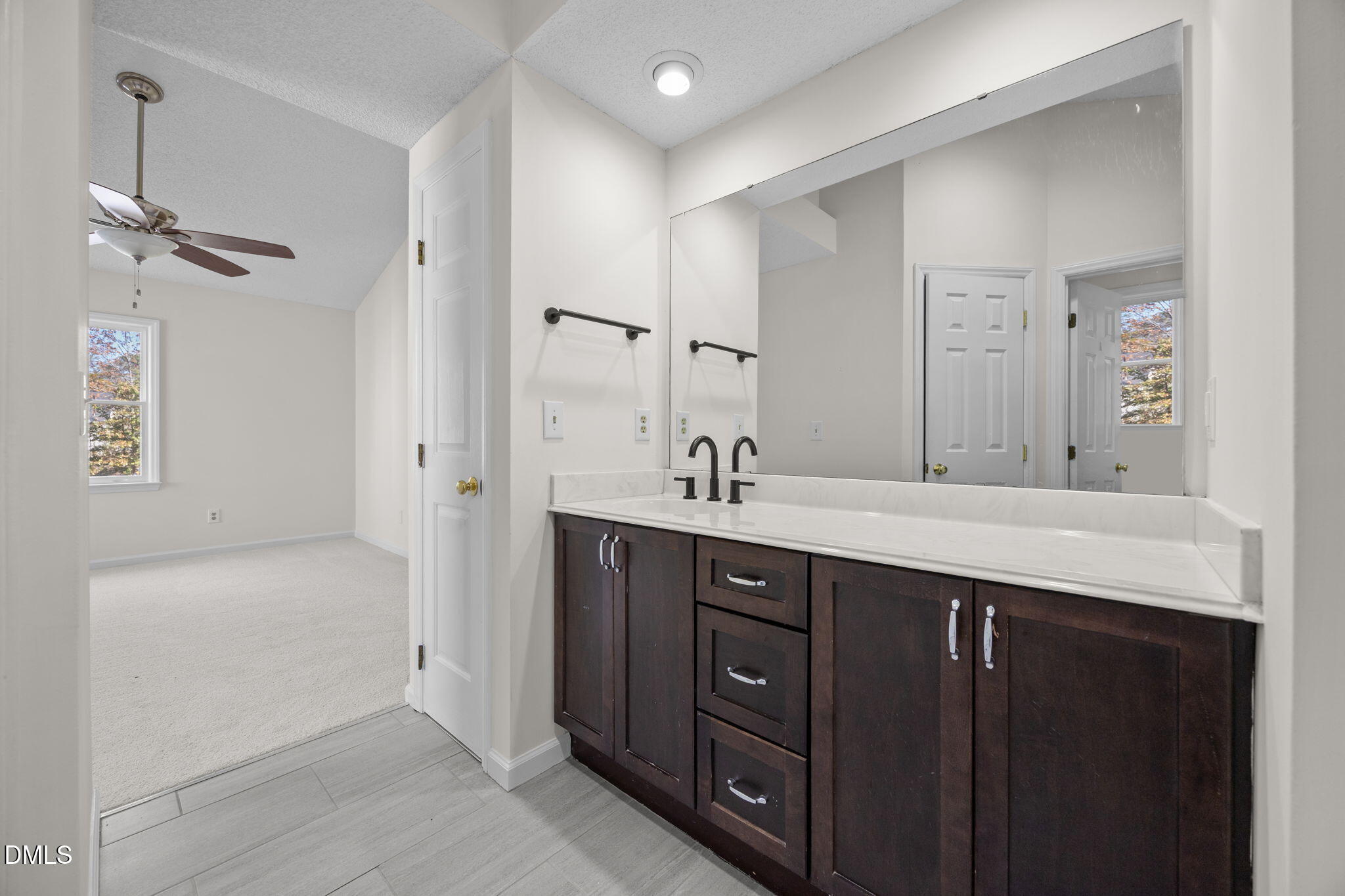 102 Korbel Place Cary, NC 27513 - Photo 24 of 43 a bathroom with a sink vanity and a mirror