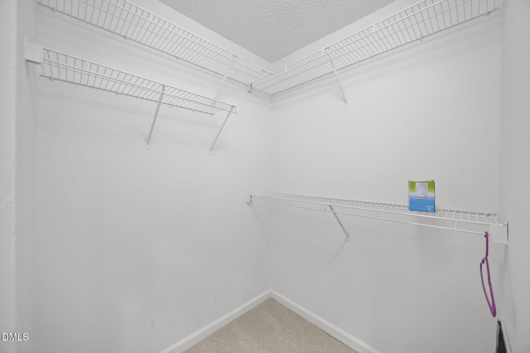 102 Korbel Place Cary, NC 27513 - Photo 25 of 43 a view of a room with racks on the wall