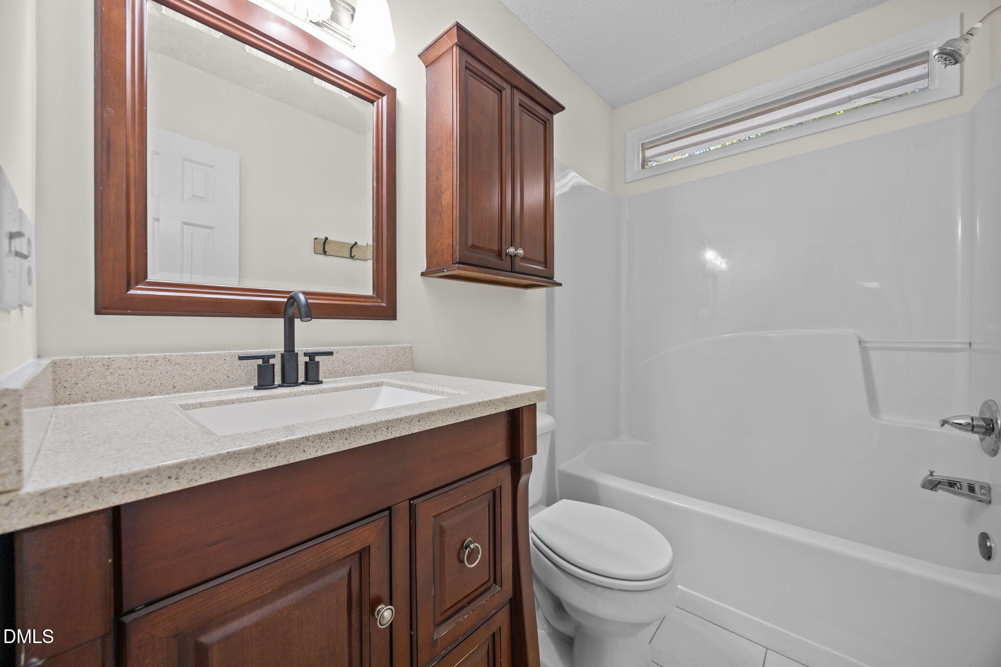 102 Korbel Place Cary, NC 27513 - Photo 27 of 43 a bathroom with a granite countertop sink toilet and shower