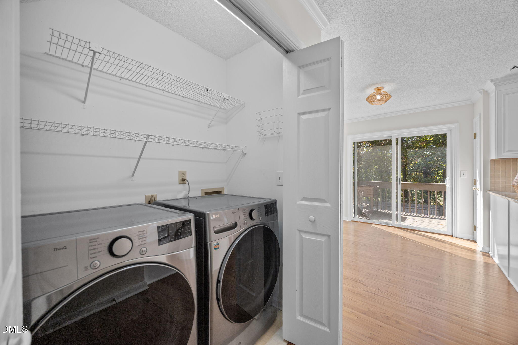 102 Korbel Place Cary, NC 27513 - Photo 29 of 43 a view of storage and utility room with washer and dryer