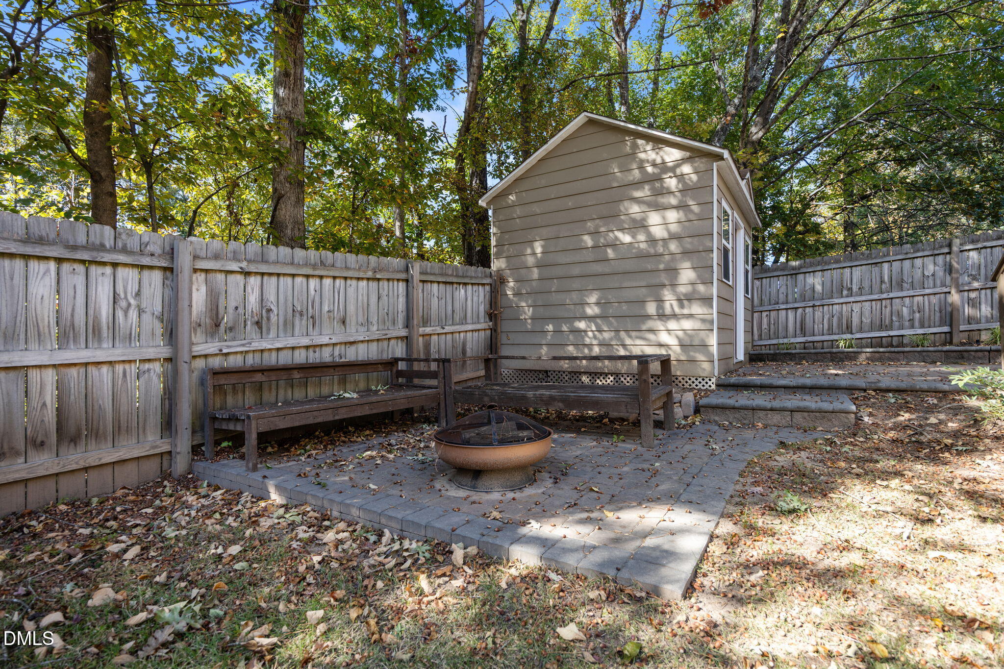 102 Korbel Place Cary, NC 27513 - Photo 34 of 43 a backyard of a house with barbeque oven fire pit and outdoor seating