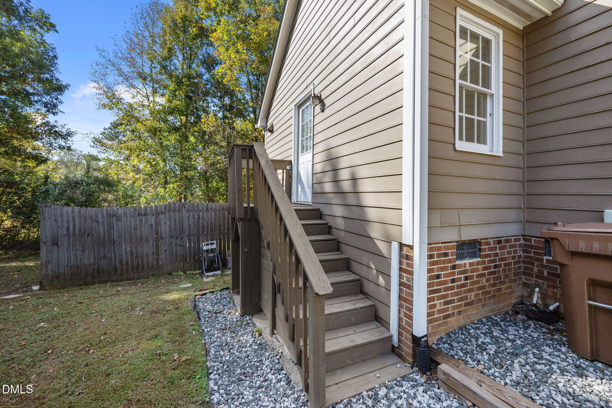 102 Korbel Place Cary, NC 27513 - Photo 42 of 43 a view of a pathway of a house and wooden fence
