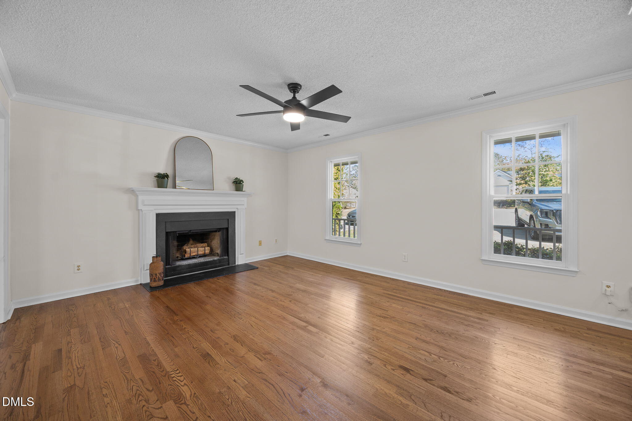 102 Korbel Place Cary, NC 27513 - Photo 8 of 43 an empty room with windows fireplace and a sink
