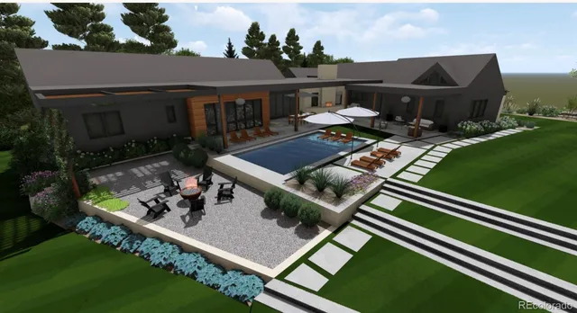 an aerial view of a house with a yard and garden