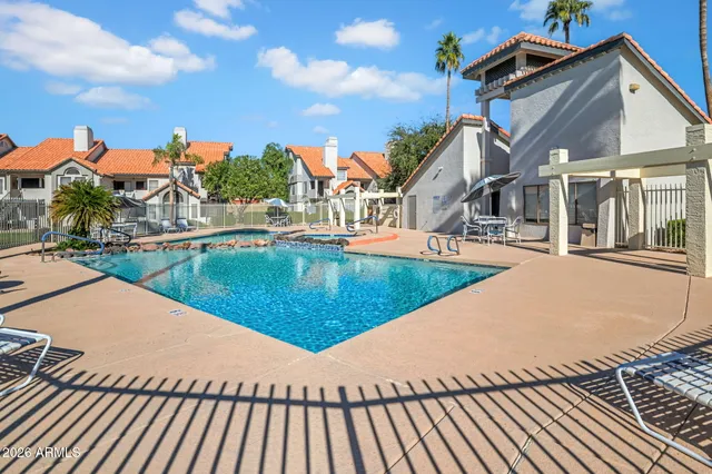 a view of a swimming pool with a lounge chairs