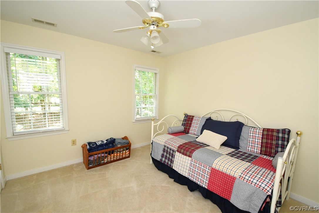 1438 Palmore Road Powhatan, VA 23139 - Photo 25 of 41 One of the bedrooms on the second floor. Carpet and ceiling fan.