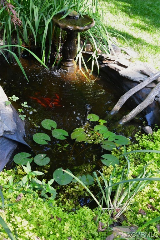 1438 Palmore Road Powhatan, VA 23139 - Photo 39 of 41 Koi pond. It's so calming to hear the waterfall.