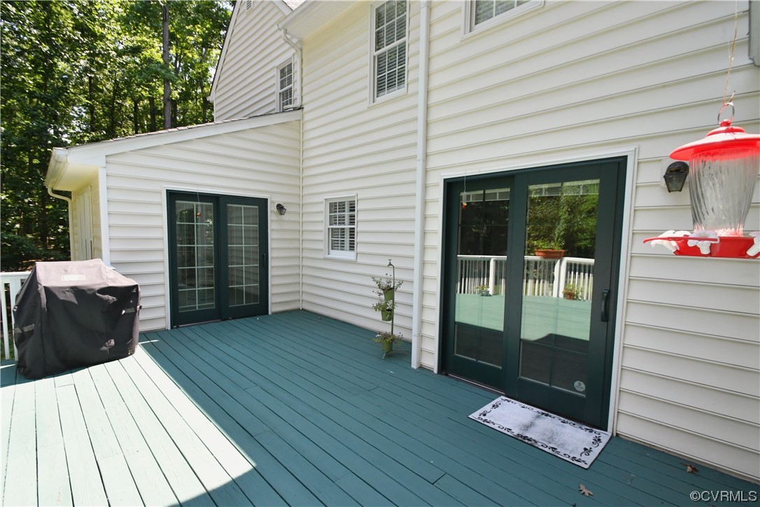 1438 Palmore Road Powhatan, VA 23139 - Photo 40 of 41 Back deck again, doors on the left side are from the Florida room and the other doors on the right side are from the kitchen.