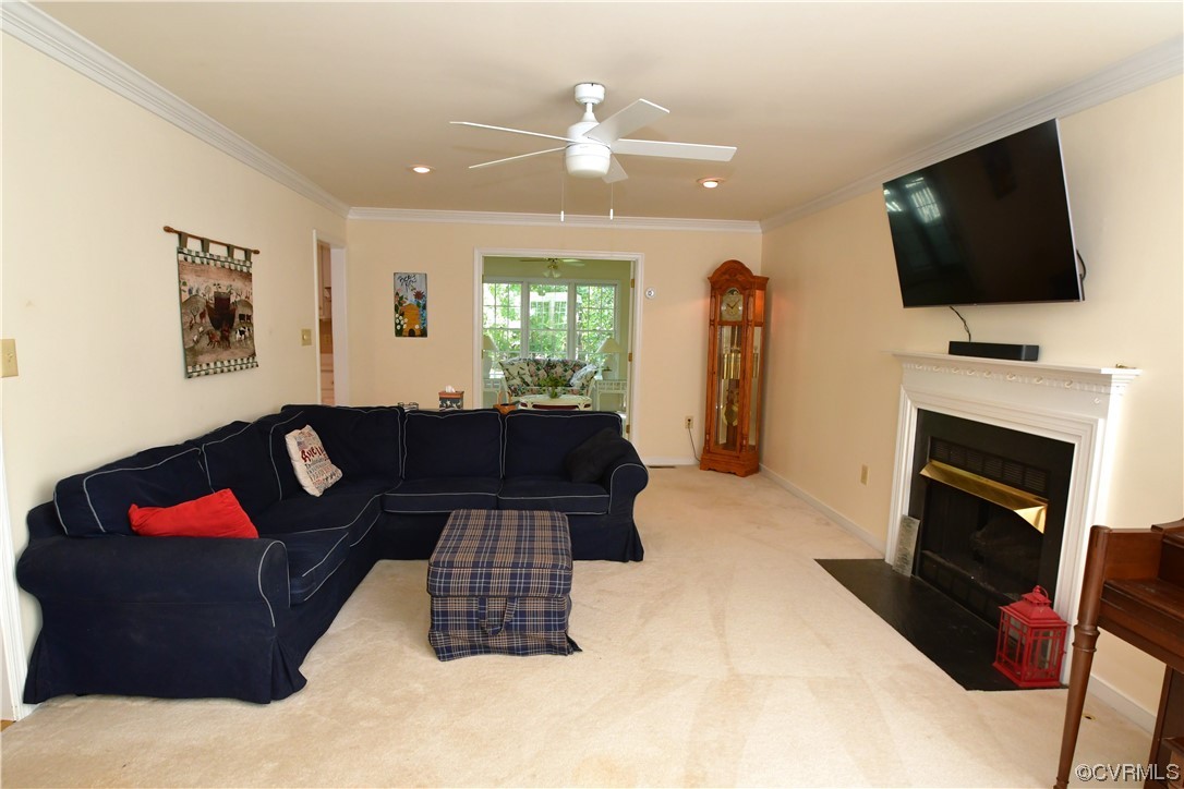 1438 Palmore Road Powhatan, VA 23139 - Photo 6 of 41 Ceiling fan, crown molding and gas fireplace in great room. French doors go into the Florida room.