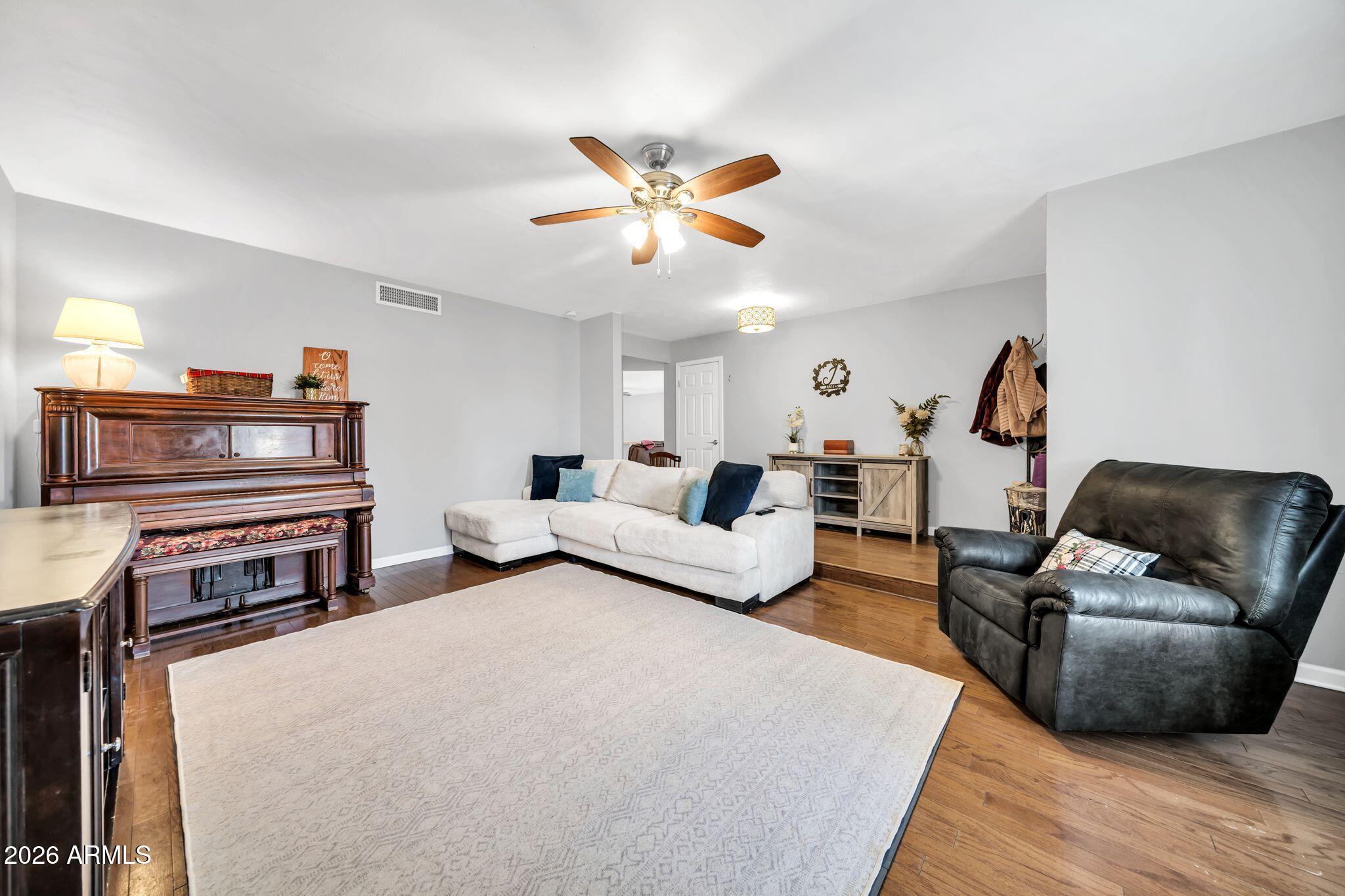 3041 West Acoma Drive Phoenix, AZ 85053 - Photo 5 of 35 a living room with furniture and a flat screen tv