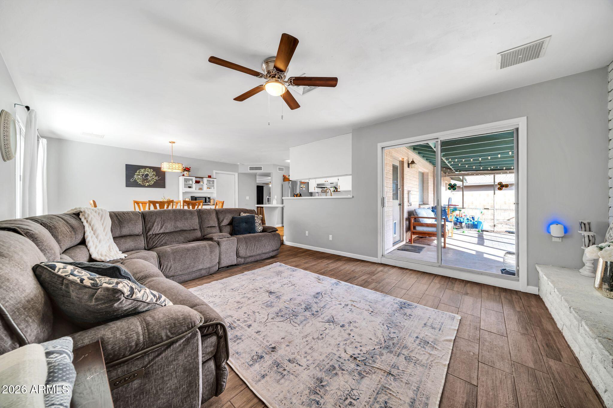 3041 West Acoma Drive Phoenix, AZ 85053 - Photo 7 of 35 a living room with furniture and a large window