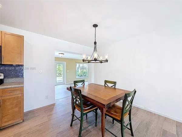 a view of a livingroom with a ceiling fan and window