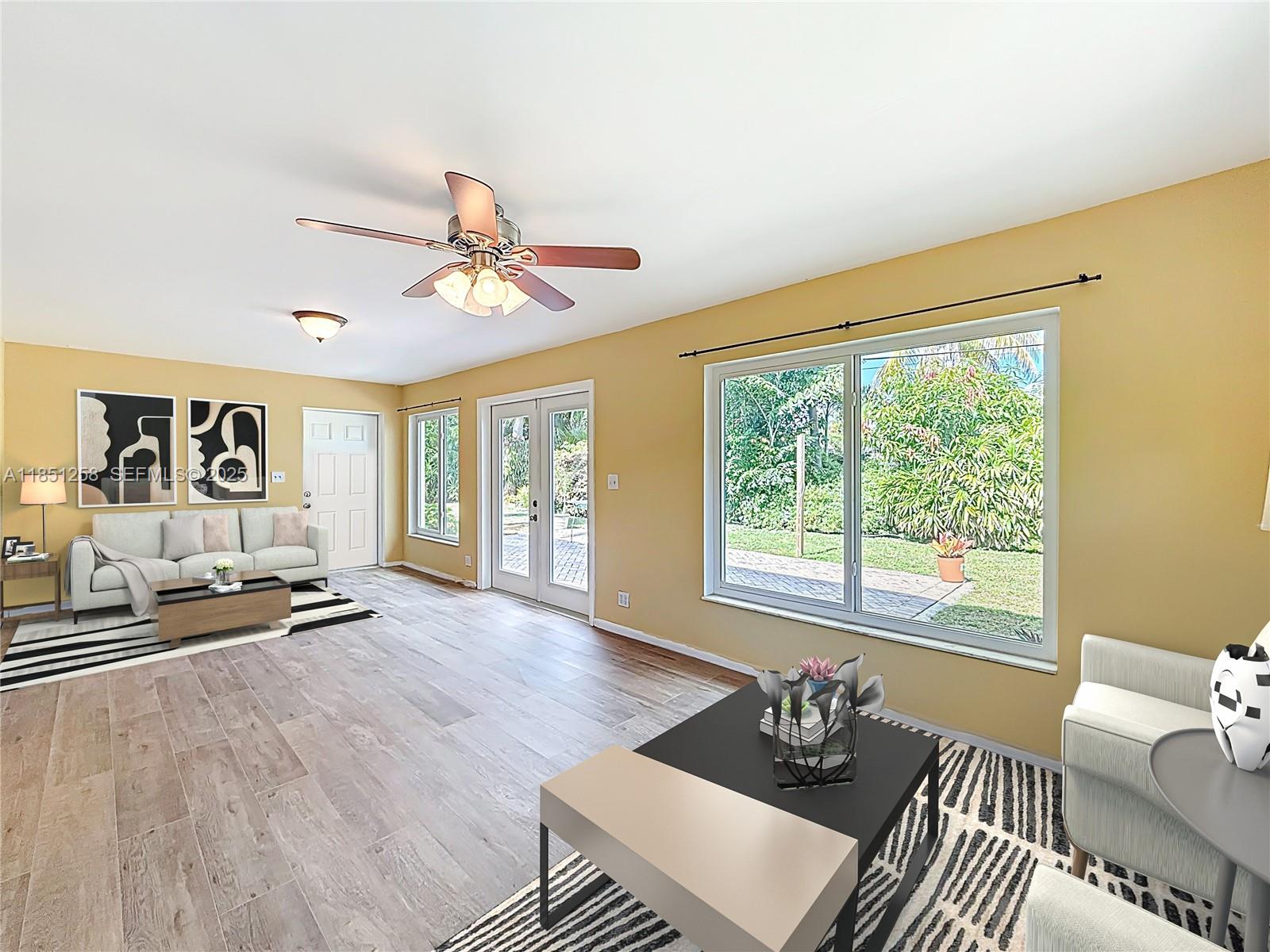 4911 Northeast 24th Avenue Lighthouse Point, FL 33064 - Photo 20 of 63 a living room with furniture and a large window